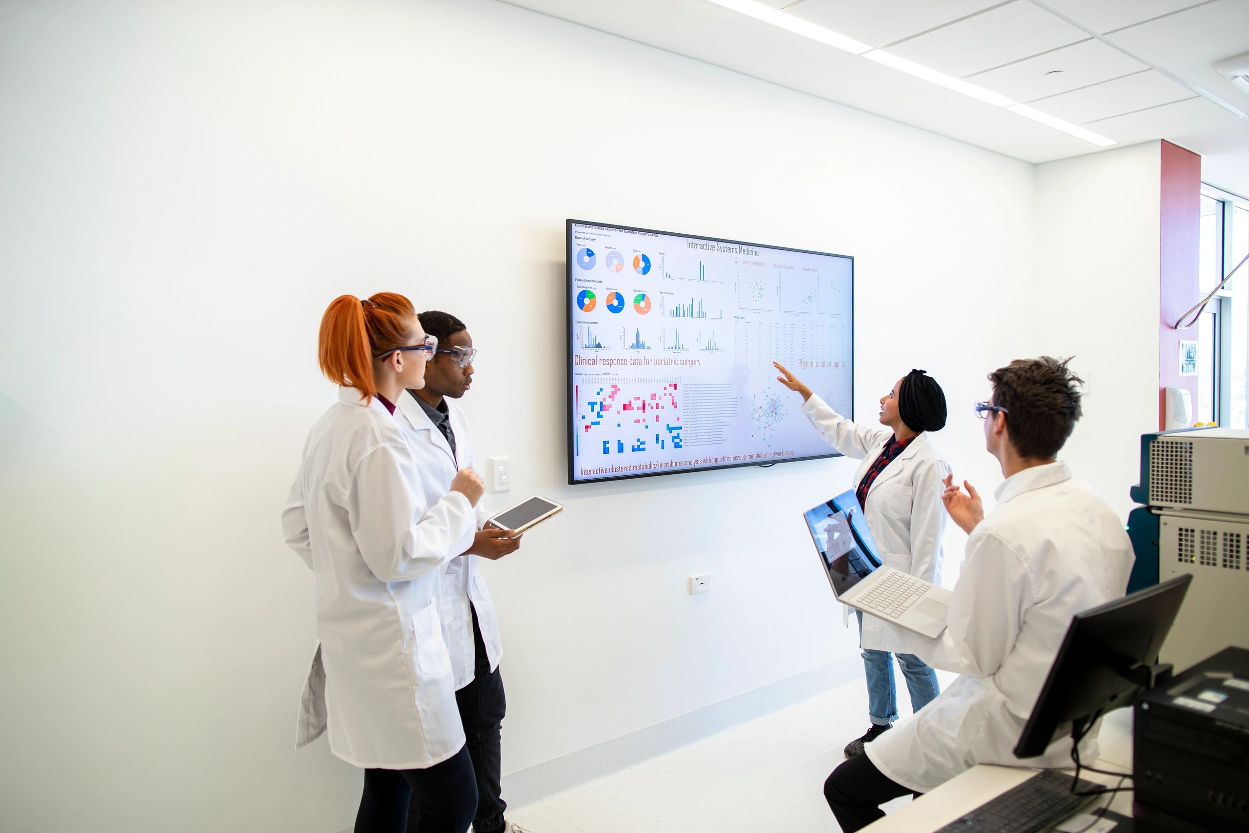 Scientific team discussing technical data and research findings