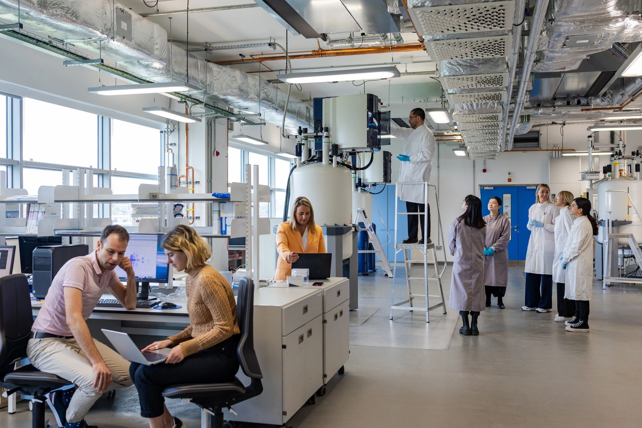 Scientists reviewing analytical data in a laboratory environment