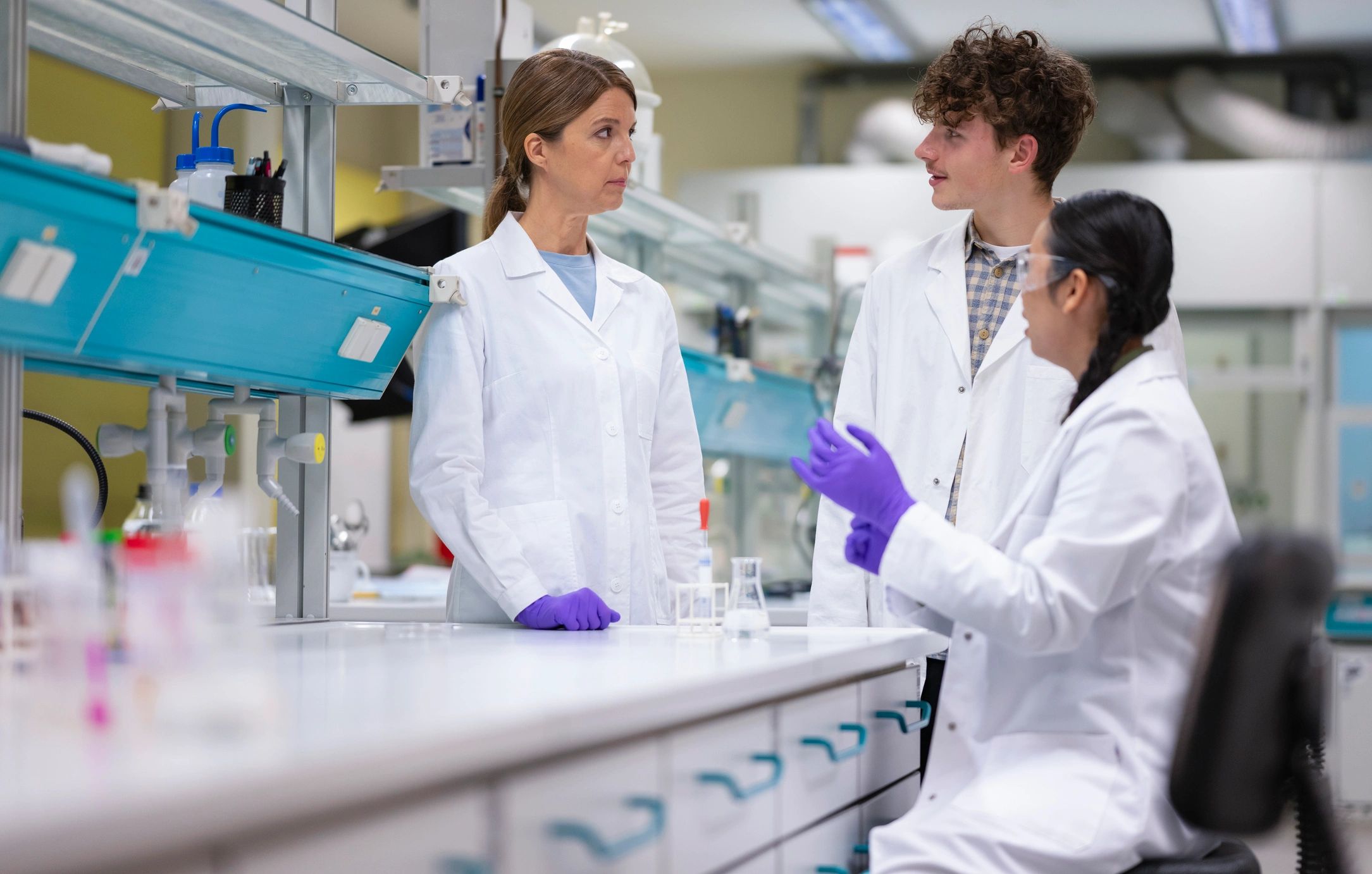 Scientists having a discussion in the laboratory
